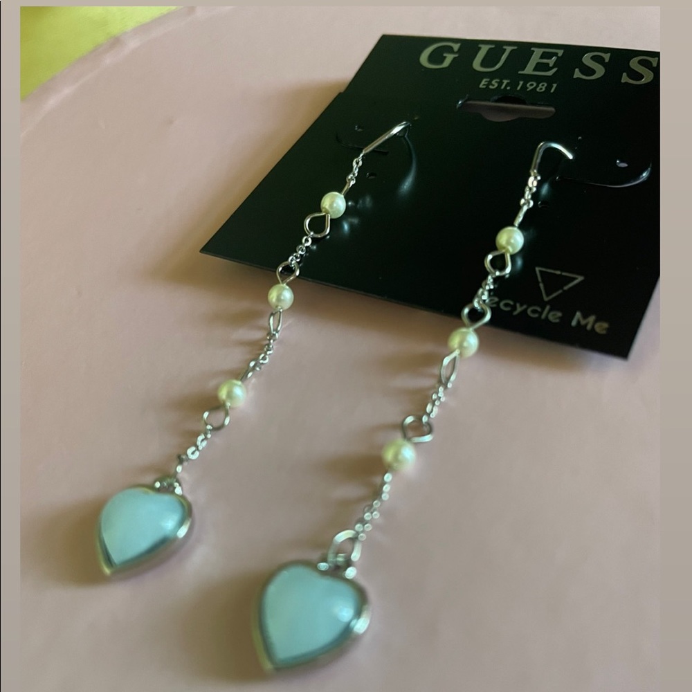 Long Hearted Earrings at just $20. Brand is Guess EST. 1981. Color- Light Blue.